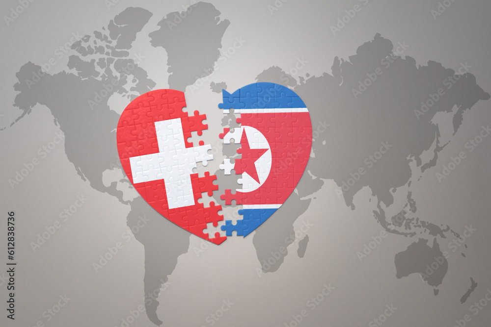 puzzle heart with the national flag of north korea and switzerland on a ...