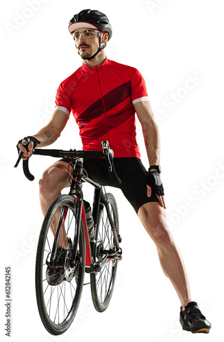 Young caucasian professional male bike rider, cyclist on road bike over transparent background.