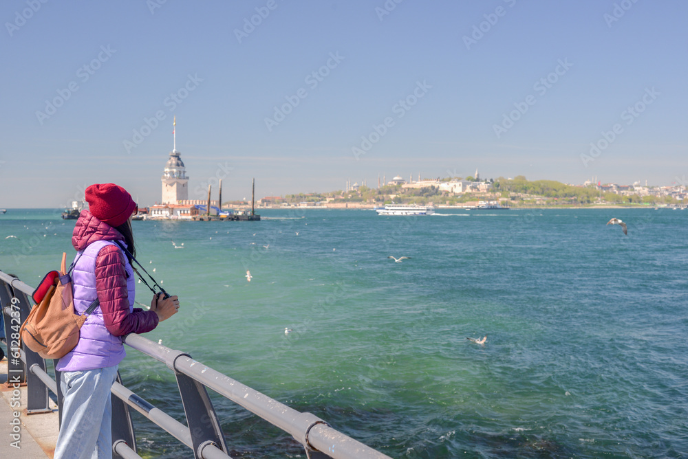 A woman tourist enjoys a view of the Maiden's Tower. T
