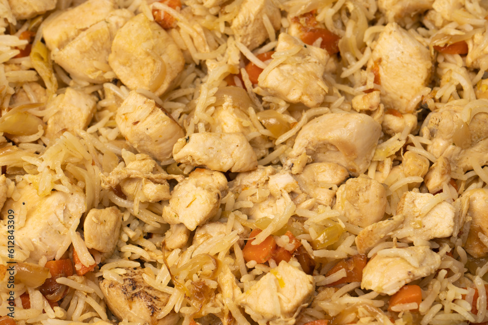 Tasty pilaf with chicken as background. Tasty pilaf with chicken as background.
