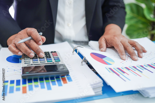 Businessman working and analysis with statistic graph in office.