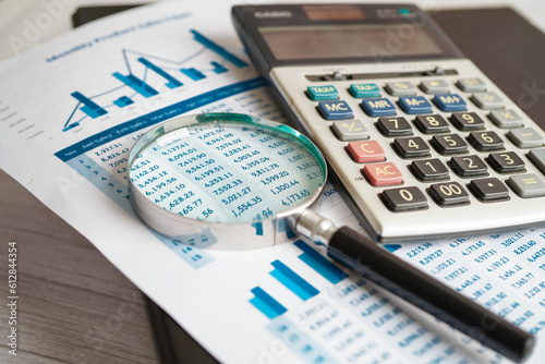Calculator on chart and graph spreadsheet paper. Finance development, Banking Account, Statistics, Investment Analytic research data economy, Stock exchange trading, Business company concept.