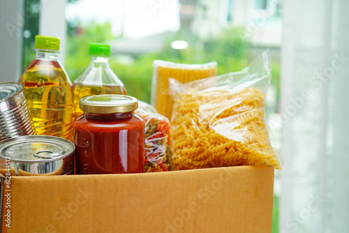Foodstuffs in donation box for volunteer.