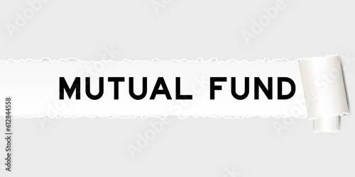 Ripped gray paper background that have word mutal fund under torn part