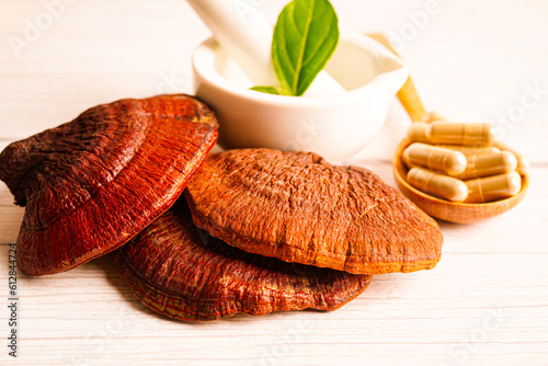 Lingzhi or Reishi mushroom with capsules, organic natural healthy food.