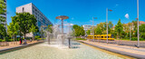 Dresden, Germany - Panoramic over fountain called Schalenbrunnen in Dresden with famous yellow tram. Cityscape of the downtown at sunny Spring day and blue sky.