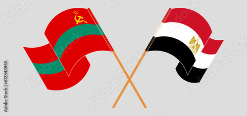 Crossed and waving flags of Transnistria and Egypt