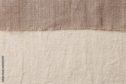 Linen in different textures and colors. Natural fabrics from organic flax and cotton, homespun textile handmade. Burlap and canvas for eco, rustic, boho, hygge decor closeup background