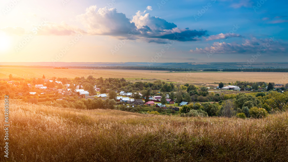 Russian rural landscape in summer. View from the mountain to the Russian village.