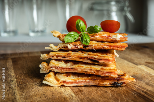 Obraz na plátně Hybrid food - pizza waffle with tomato sauce, pepperoni, olives and parmesan che
