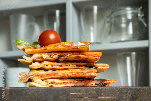 Fotografía Homemade pizza waffle with tomato sauce, pepperoni, olives and parmesan cheese o