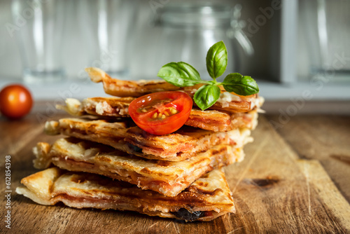 Pizza waffle slices on a cutting board in the kitchen