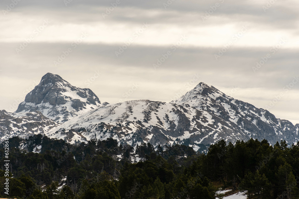 Mountain range with snowcapped peaks in Baqueira ski fields, Catalonia pyrenees