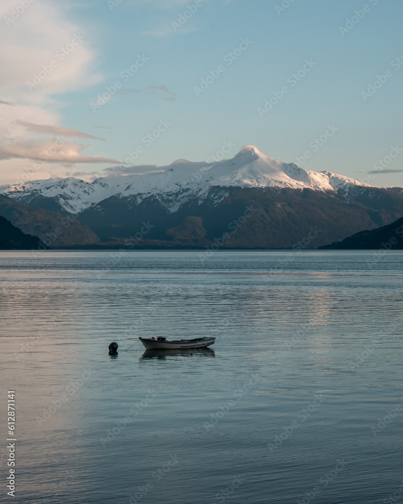 Fototapeta premium lake in the mountains. boat in a lake. volcano. winter.