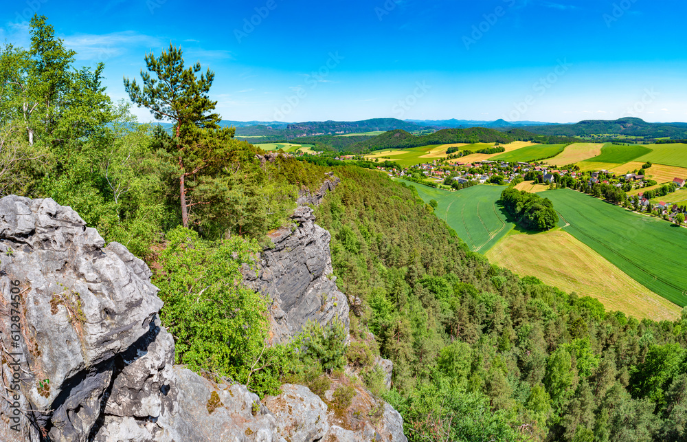 Panoramic over sandstone rocks and valley viewed from Papststein and top bird view at the hiking trail in the national park Saxon Switzerland, Bad Schandau, Germany.