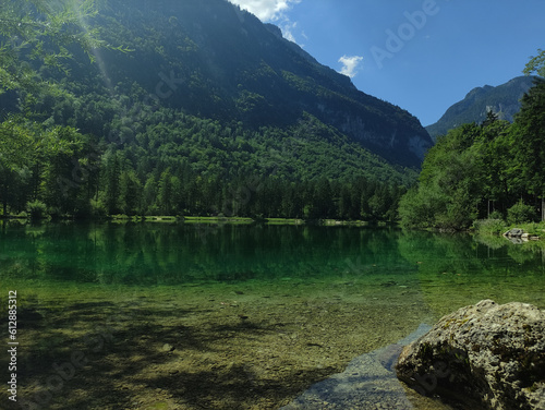 Fototapeta Naklejka Na Ścianę i Meble -  Bluntausee, Salzburger land, Austria. Mountain lake. Alps. Blue crystal clear water. Summer rocky landscape. Hiking place. Green landscape. Trees. Lake coastline.