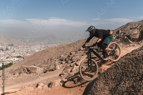 cyclist practicing mountain biking, enduro.