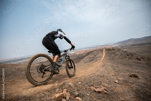 cyclist practicing mountain biking, enduro.