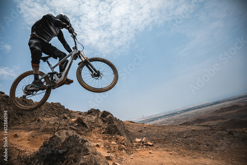cyclist practicing mountain biking, enduro.