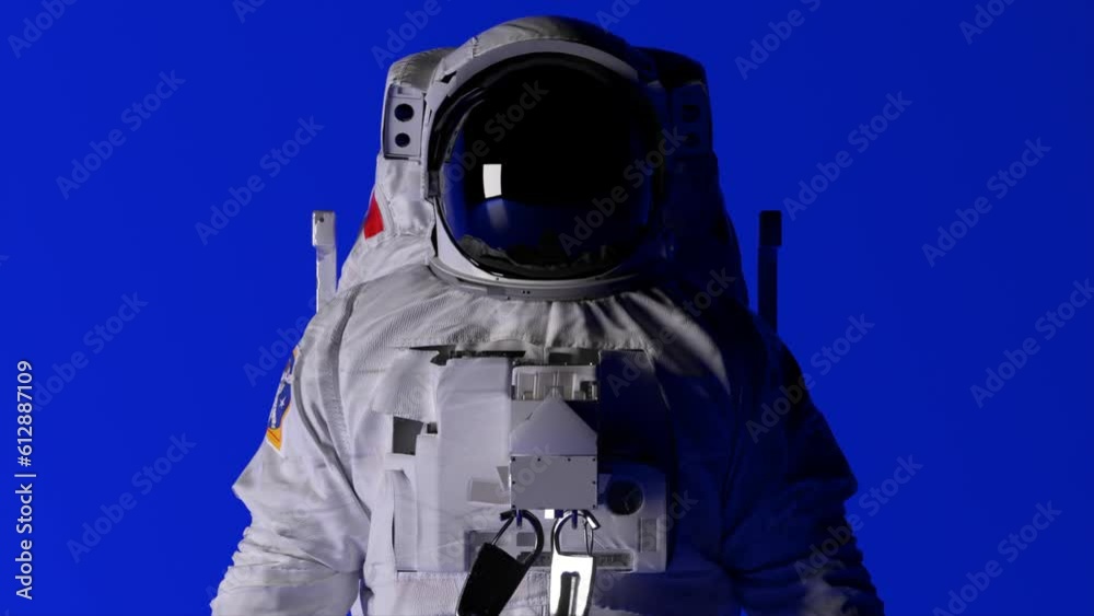 The head of an astronaut on a blue background. Lighting is changing. Chroma key. Helmet. Dark and light. 3d animation The head of an astronaut on a blue background. Lighting is changing. Chroma key. Helmet. Dark and light. 3d animation