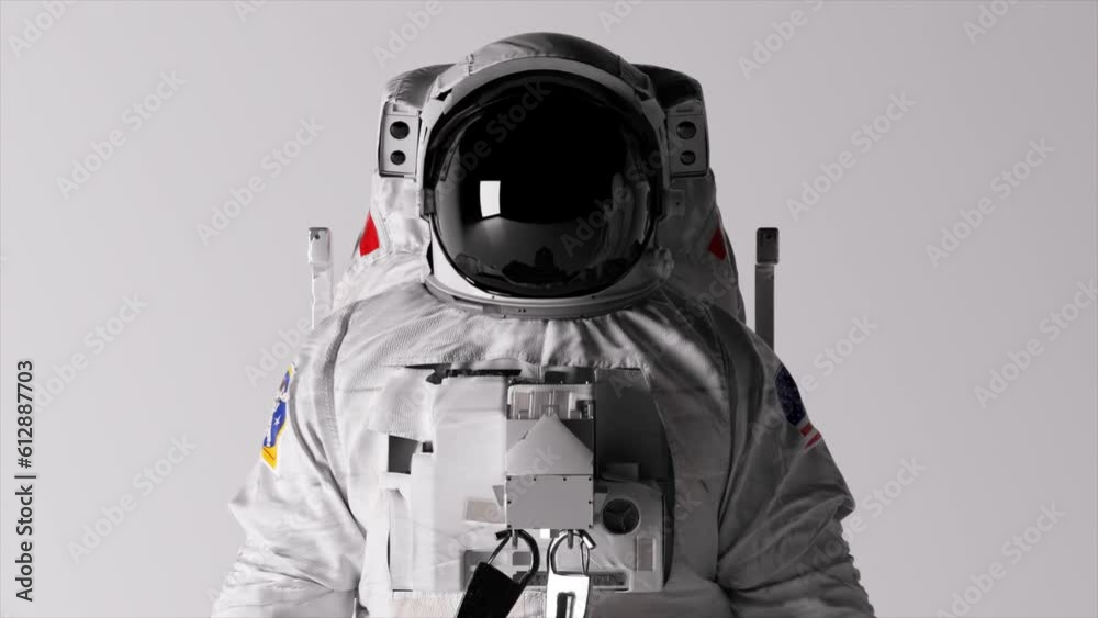 The head of an astronaut on a white background. Lighting is changing. Helmet. Dark and light. Shadows on the wall. The head of an astronaut on a white background. Lighting is changing. Helmet. Dark and light. Shadows on the wall.
