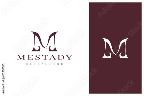 elegant simple minimal luxury letter m logo design © theos studio