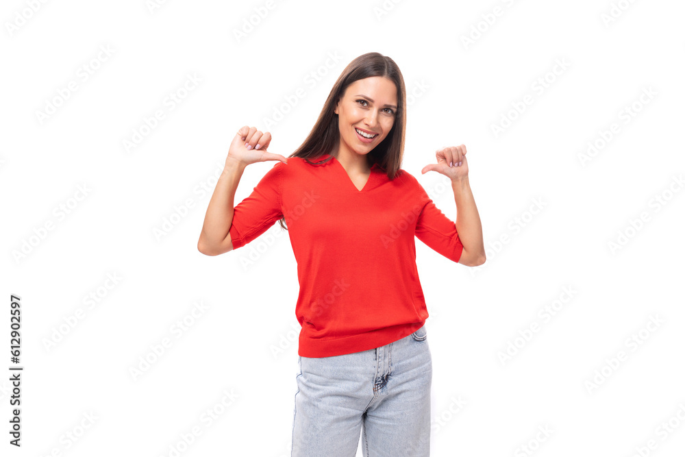 young european woman with black hair dressed in a red t-shirt on a white background with copy space