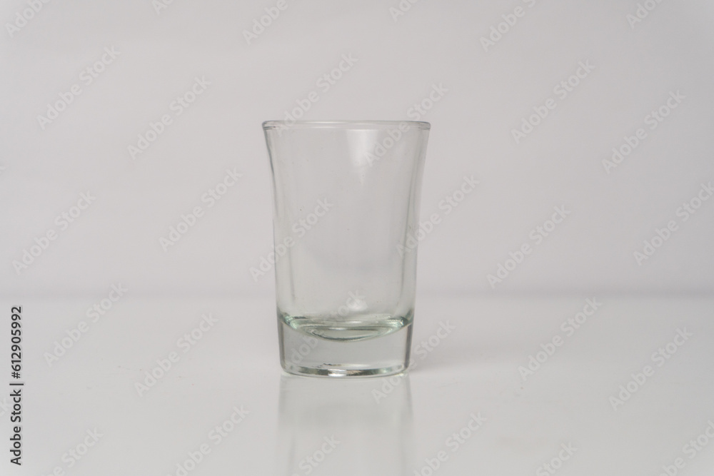 Refreshing Drink in Transparent Glass on White Background Refreshing Drink in Transparent Glass on White Background
