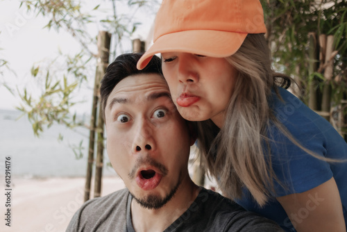 Funny face of selfie lovely asian couple man and woman.