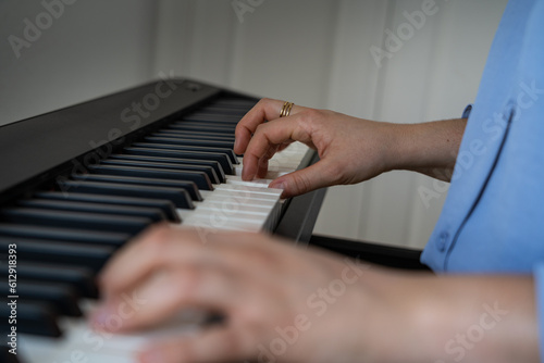 Woman plays the piano