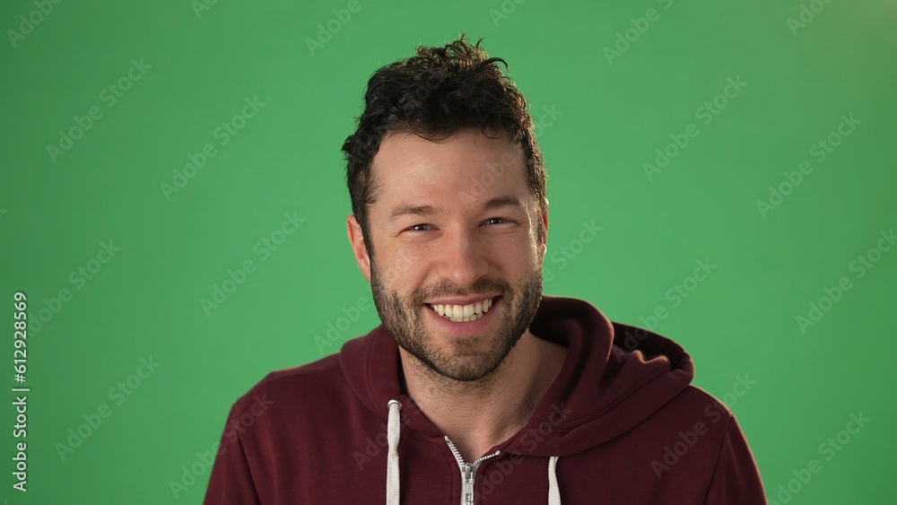Fototapeta premium Smiling young hip guy having video chat with friends or family. Happy man talking and laughing looking at web cam during communicate in online chat. webcam view, videochat concept.