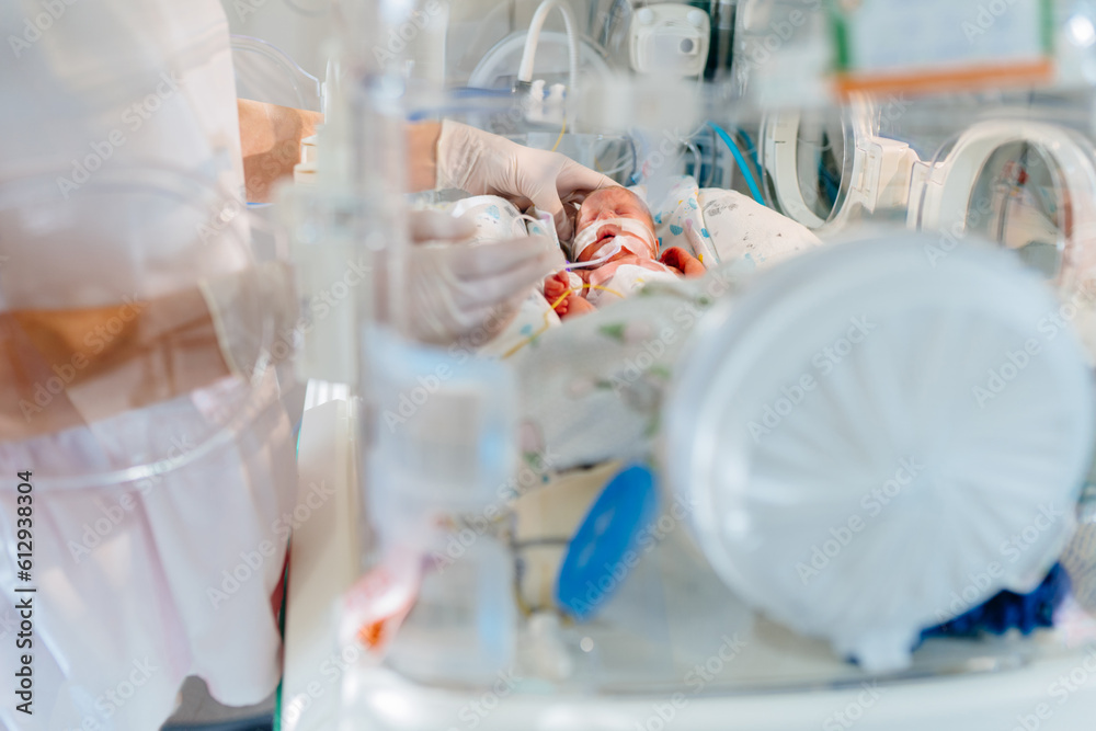 Unrecognizable hand in gloves of nurse or doctor taking care of