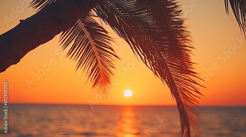 Palm tree leaves silhouette on bright sunset background. AI generated.