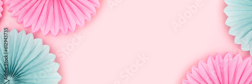 Banner with frame made of tissue paper fans in a blue and pink colors. Creative composition with place for your design.