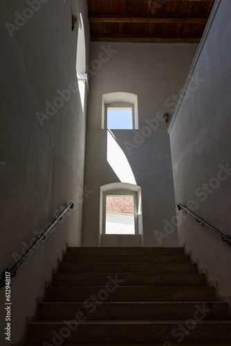 Stone stairs in the fortress historical Fagaras Fortress on a sunny day. Transylvania. Romania