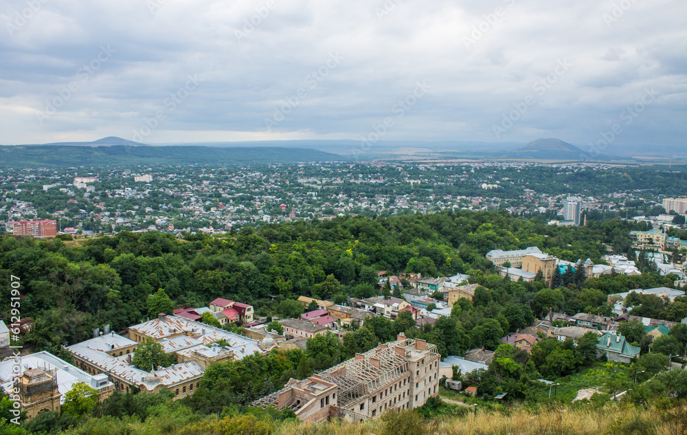 Pyatigorsk, Stavropol Territory, Russia - July, 21, 2022: panoramic view of the historical part of the city with beautiful architecture from the observation deck on a cloudy summer day