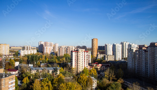 Panoramic cityscape - top view - modern high-rise buildings and autumn trees on a clear sunny day in Reutov  Moscow region
