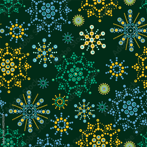 bright multicolored flowers with dots on a green background. abstract seamless wallpaper