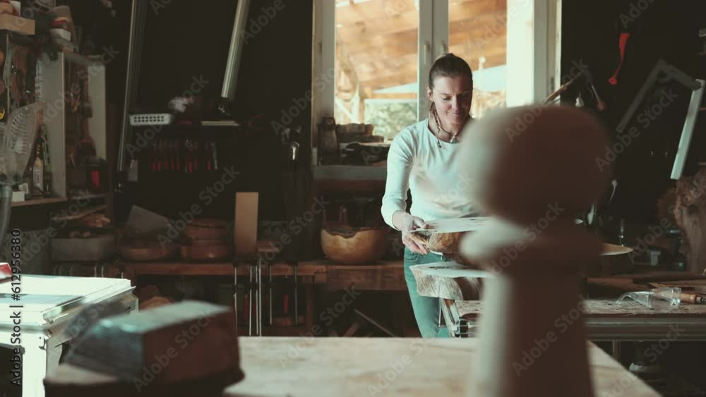 Craftswoman working with wood in carpentry workshop
Craftswoman working with wood in carpentry workshop