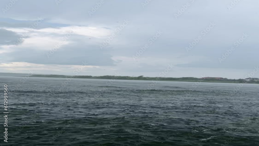 Caught in sudden summer rain on a boat on the river