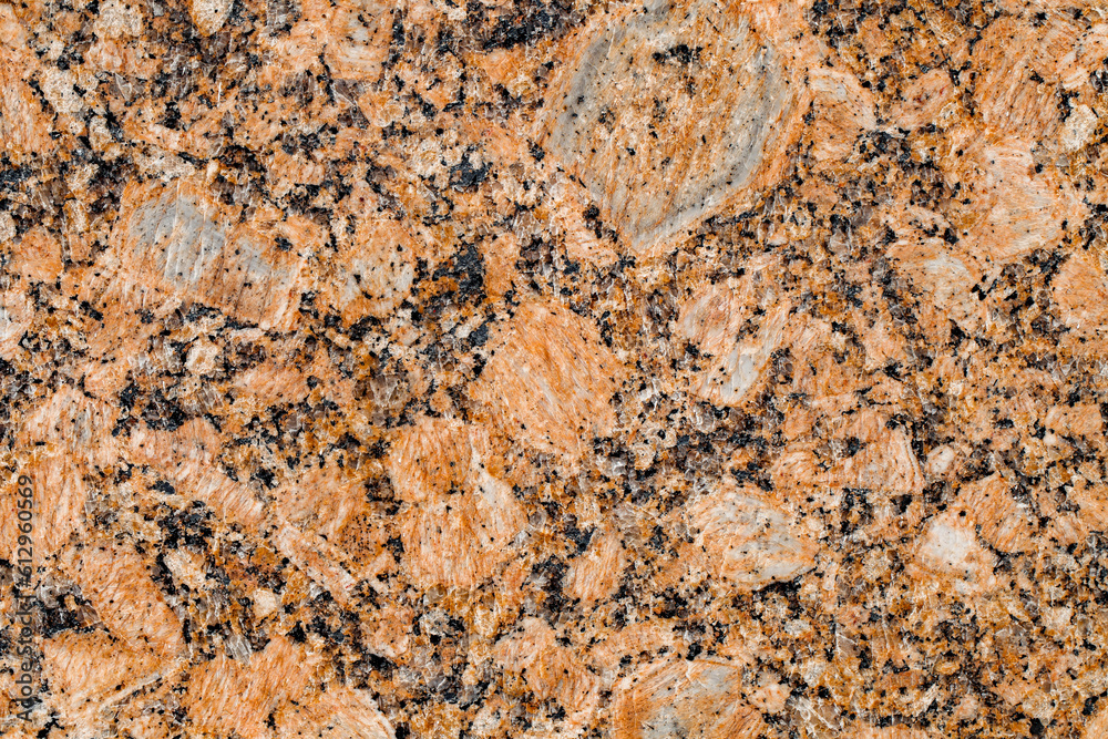 Marble tile orange with inclusions, close-up, uniform texture background Marble tile orange with inclusions, close-up, uniform texture background