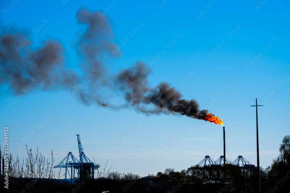 Large gas flare at an oil refinery.