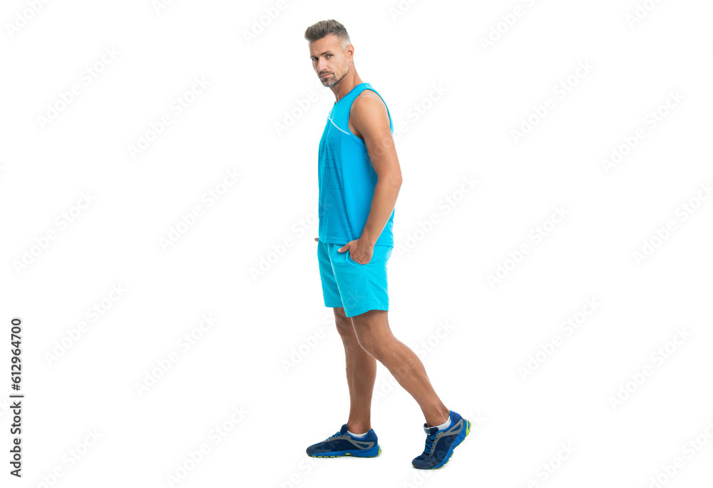 confident athlete wears sport wear standing alone. The male sport athlete posing on studio. sport athlete with fit body isolated against white. Sport and healthy lifestyle. full length of athlete confident athlete wears sport wear standing alone. The male sport athlete posing on studio. sport athlete with fit body isolated against white. Sport and healthy lifestyle. full length of athlete