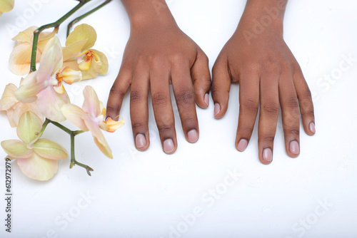 African American woman hands   black skin manicure on white background