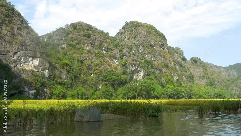 Rice paddies and amazing rock formations along the Sao Khe River near the town of Ninh Binh, Vietnam. Rice paddies and amazing rock formations along the Sao Khe River near the town of Ninh Binh, Vietnam.