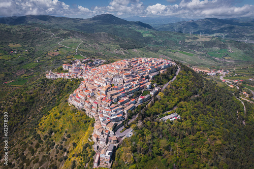 Fototapeta Naklejka Na Ścianę i Meble -  Aerial view of Italian hilltop town, Rotondella at daytime in the Calabria Region
