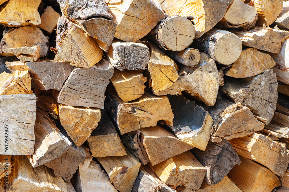 Pile of firewood, stacked dry chopped firewood logs . Preparation of fiewood for winter. Wooden background, natural texture. Pile of firewood, stacked dry chopped firewood logs . Preparation of fiewood for winter. Wooden background, natural texture.