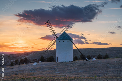 Sunset landscapes of Don Quixote windmills in Campo de Criptana, Toledo, Spain photo