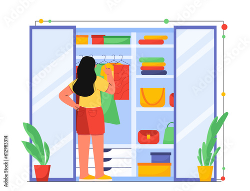 Woman standing near closet with clothes concept