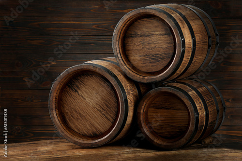 Wooden barrels on table, space for text